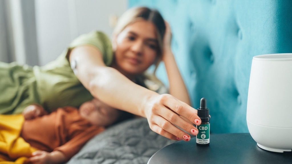woman reaching for CBD oil