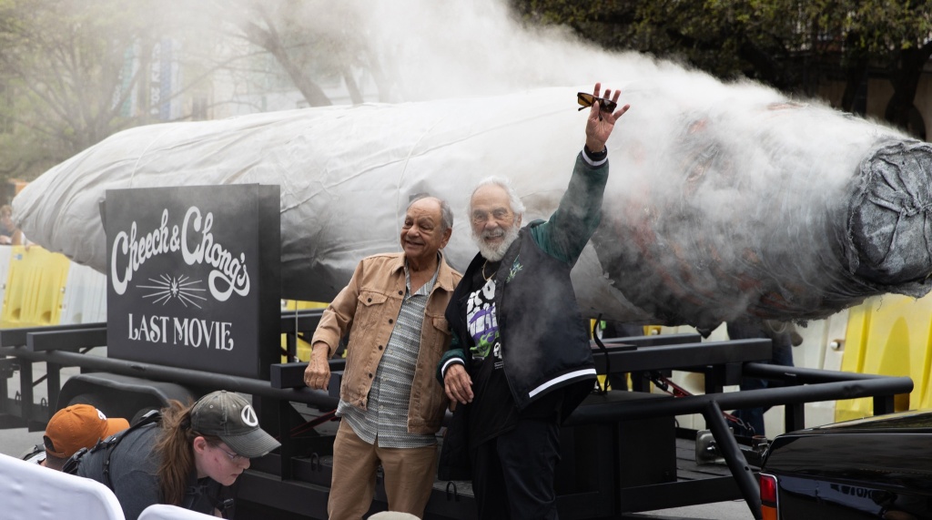 cheech and chong in front of big cannabis joint