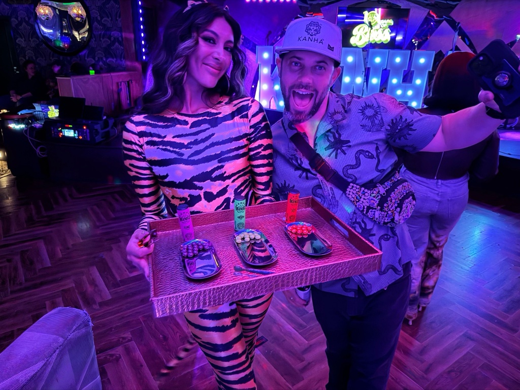 people pose with kanha edibles