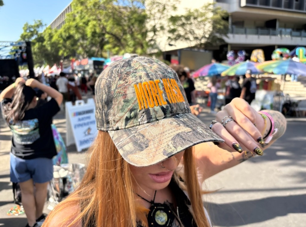 woman wears camo hat at Puffcon 2025