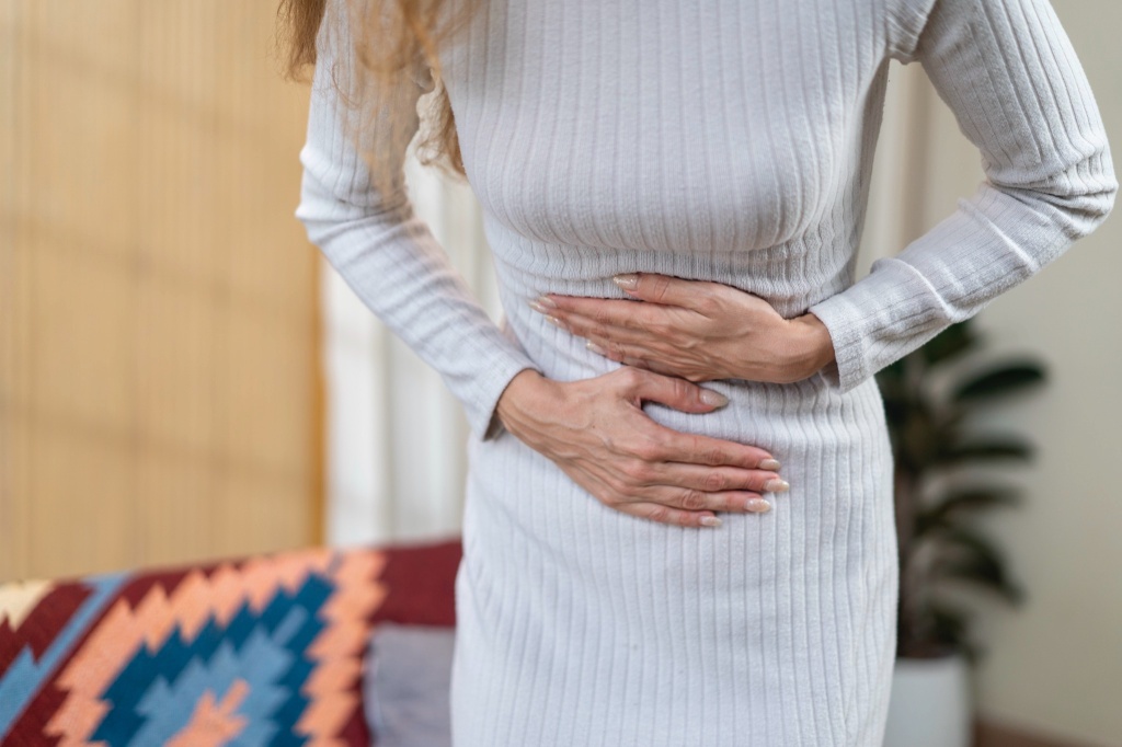 woman holding stomach