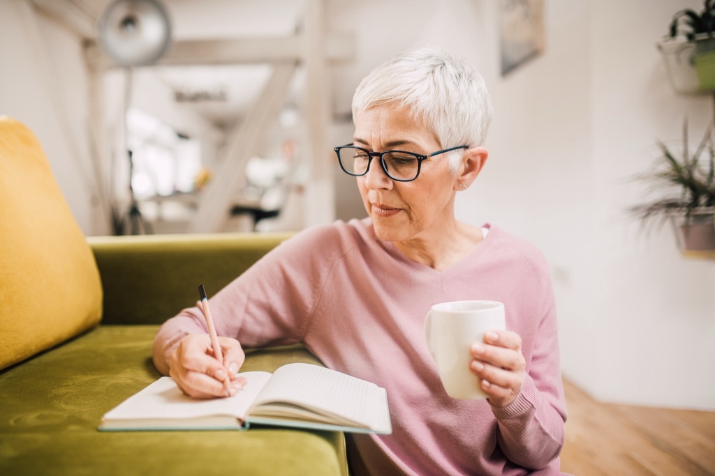woman writing in journal