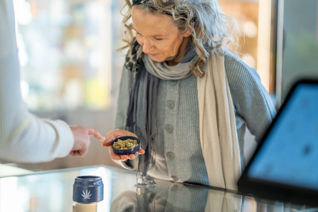 woman looking at medical cannabis for seniors
