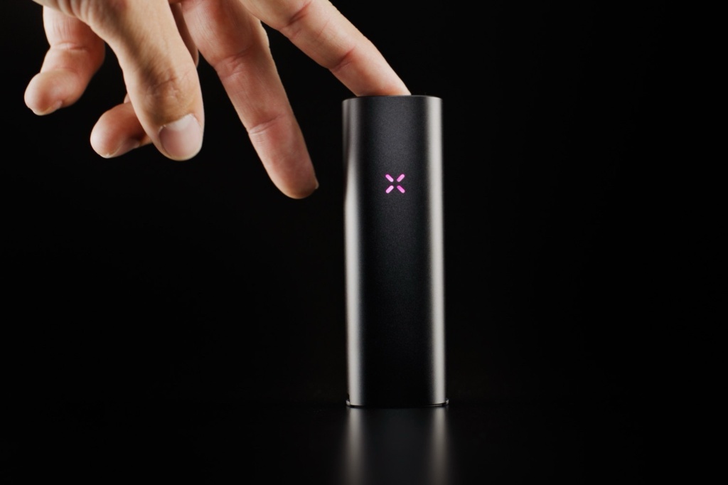 hand touching pax four device