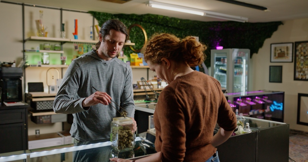 dispensary worker with customer budtenders questions