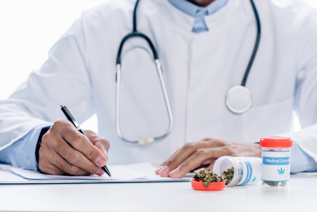 doctor writing medical cannabis prescription