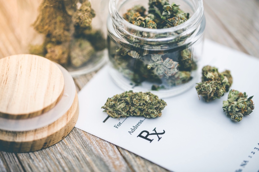 cannabis buds and prescription pad medical marijuana card