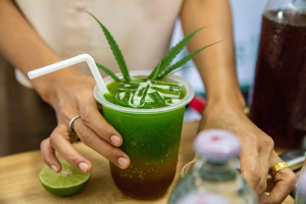 person serving hemp thc drinks