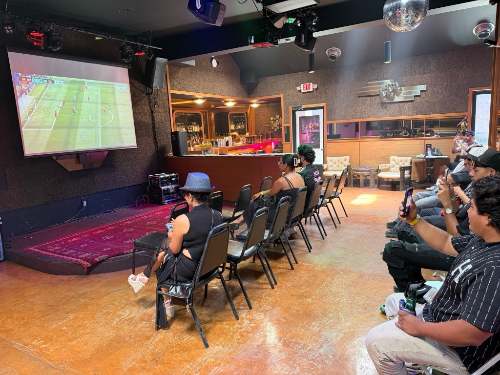 guests watch a match at the puffco world cup party