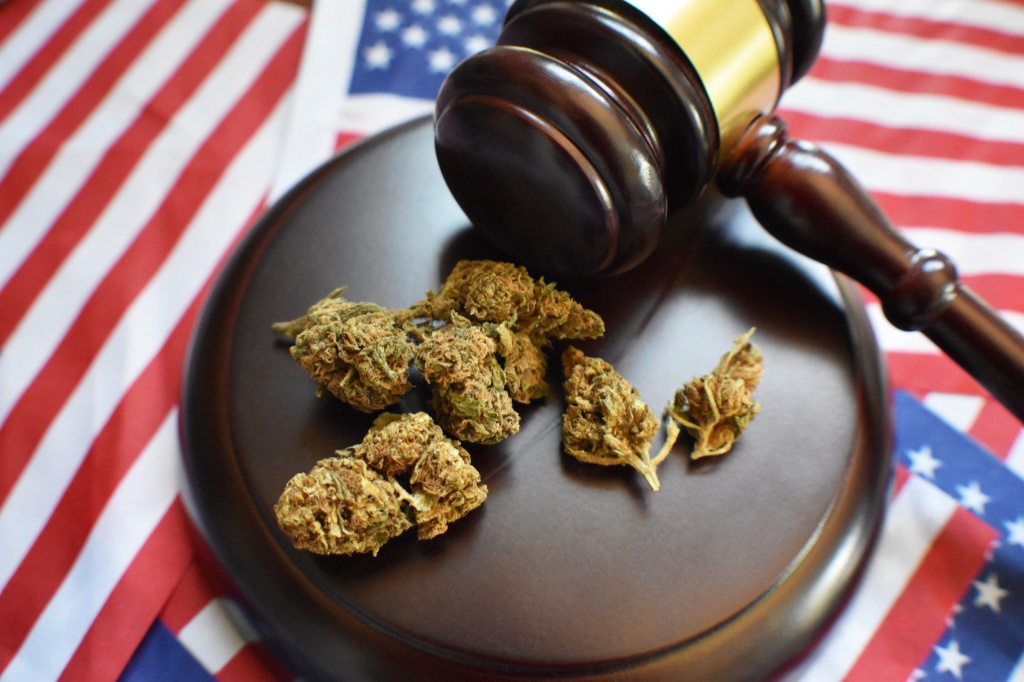 gavel over american flag with cannabis representing dea cannabis hearings next steps