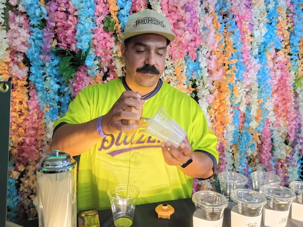 person fills cups with vaporizer smoke