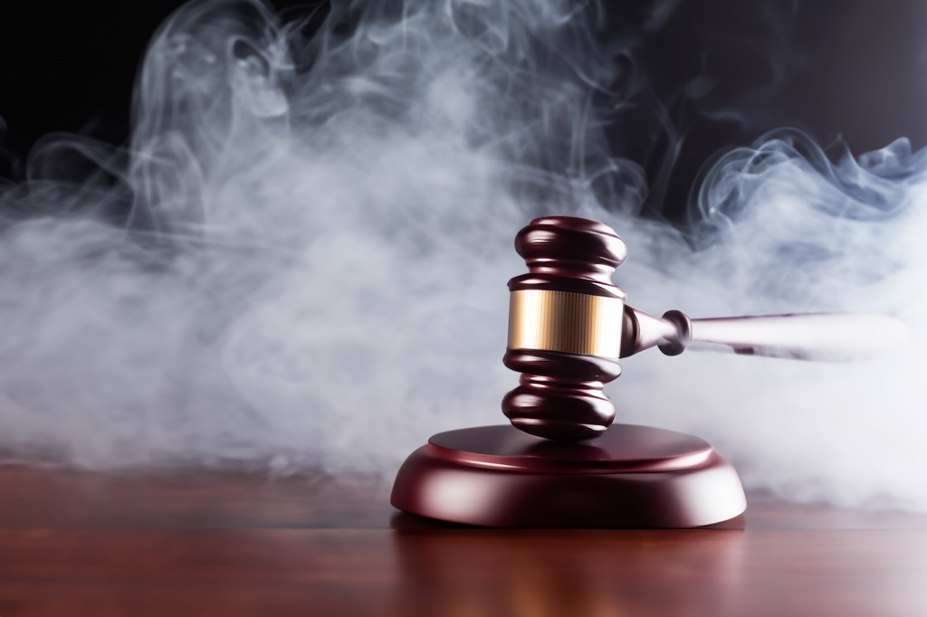 gavel in front of smoke to represent cannabis rescheduling delay
