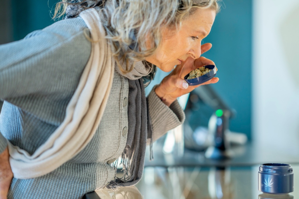 woman smelling cannabis weird weed smell