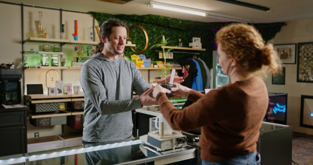 budtender at dispensary shares plant